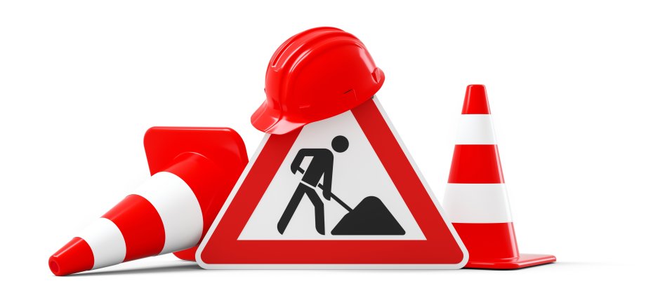 Under construction, road sign, traffic cones and red safety helmet, isolated on white background. 3D rendering
