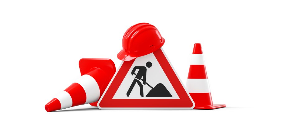 Under construction, road sign, traffic cones and red safety helmet, isolated on white background. 3D rendering